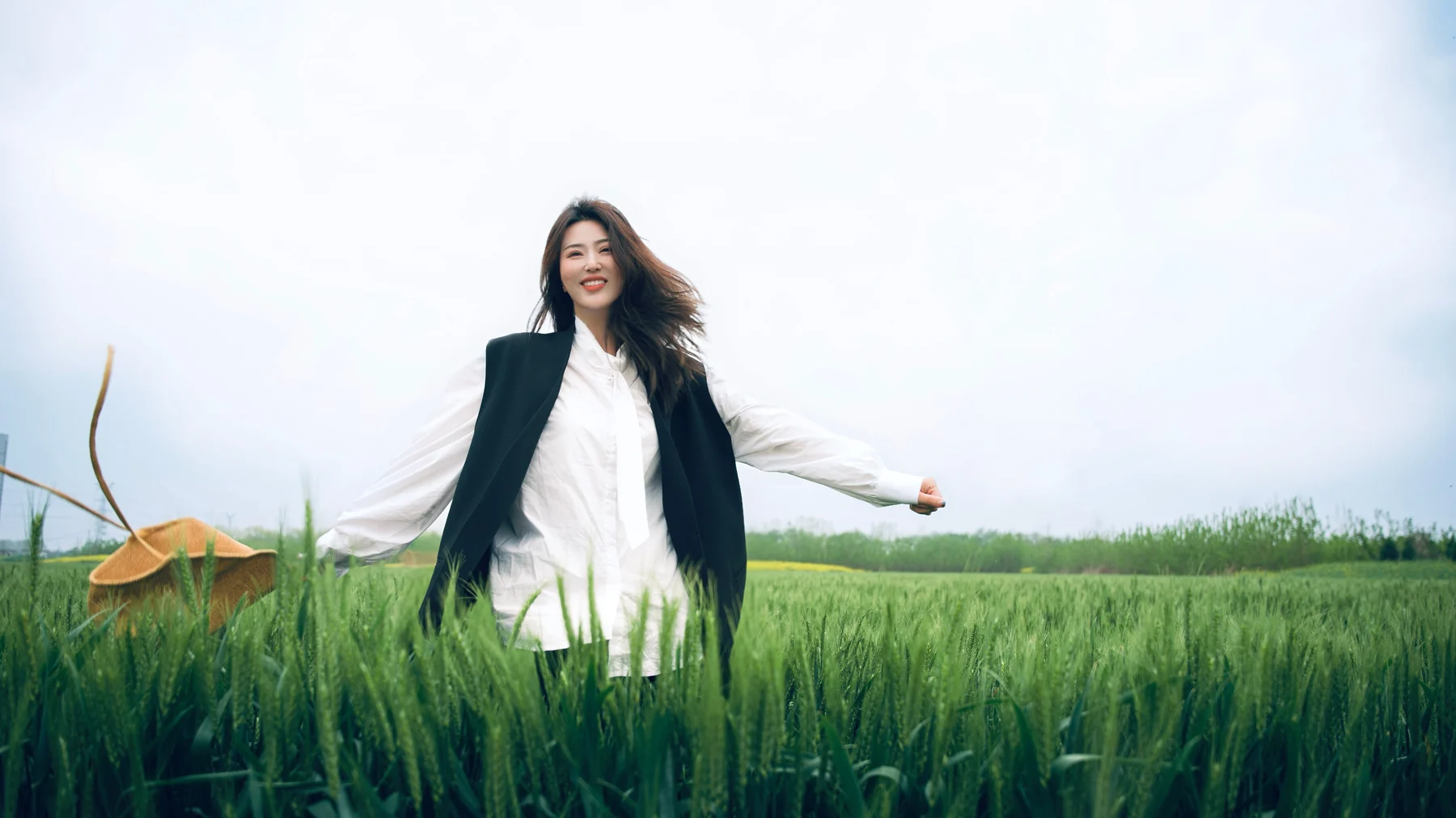 Lina moving playfully through a green field